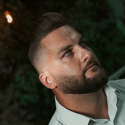 Fade with slicked-back hair and a beard – The Blades Studio, Sofia