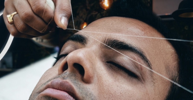 Men’s eyebrow shaping with thread